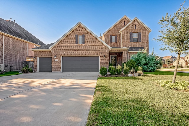 view of front of home featuring a front lawn and a garage