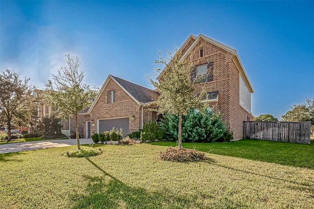 front of property with a garage and a front lawn