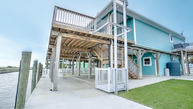 view of home's community featuring a water view and a patio