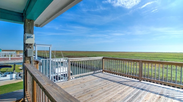 wooden terrace featuring a rural view