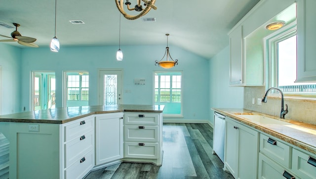 kitchen featuring white cabinetry, ceiling fan, sink, hanging light fixtures, and a center island