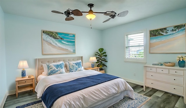 bedroom with ceiling fan and dark hardwood / wood-style floors