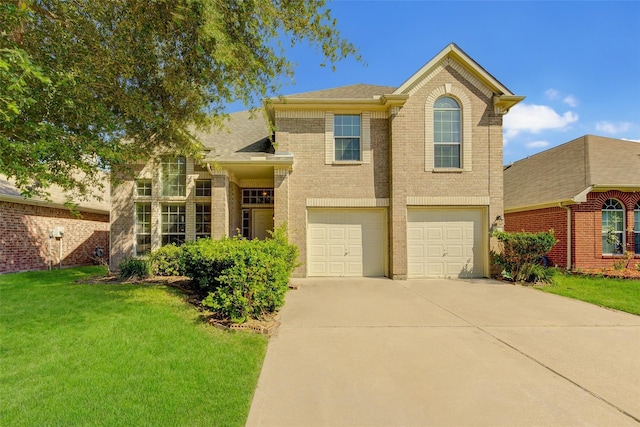 view of front of home featuring a garage and a front yard