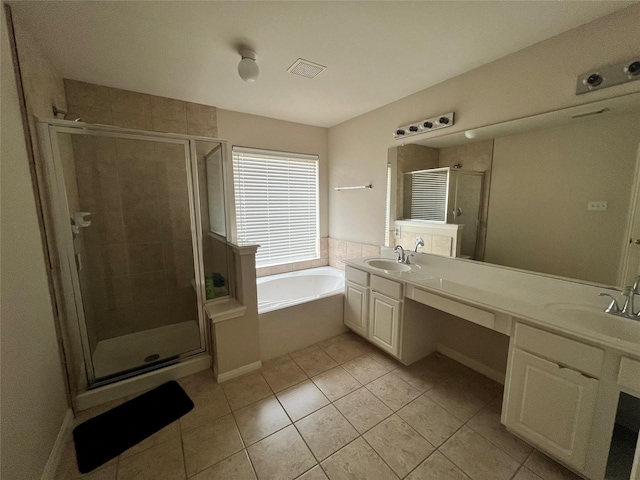 bathroom with tile patterned flooring, vanity, and independent shower and bath