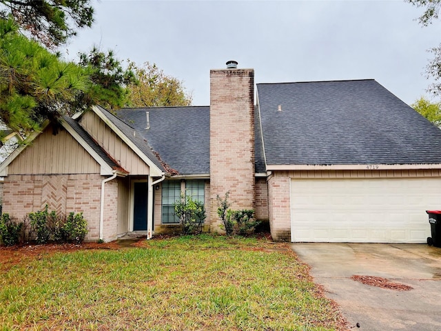 view of front facade featuring a front yard and a garage