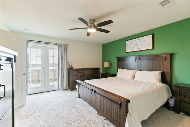 bedroom with light carpet, french doors, access to outside, and ceiling fan