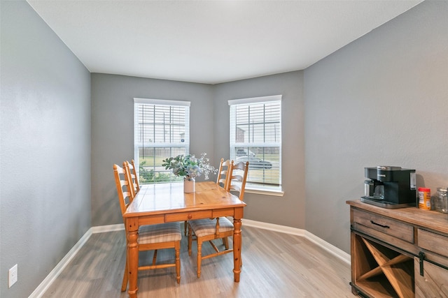 dining area featuring light wood-type flooring