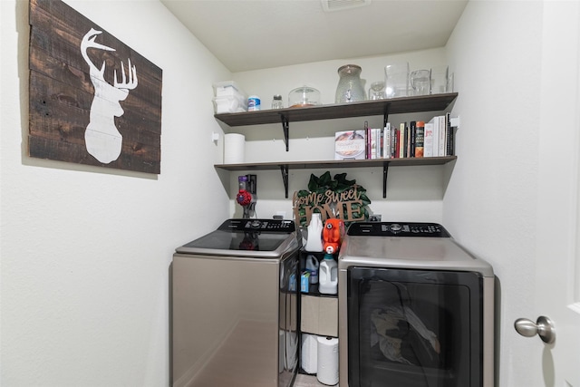 washroom featuring independent washer and dryer