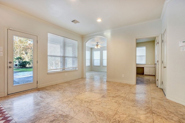 empty room with ceiling fan and ornamental molding