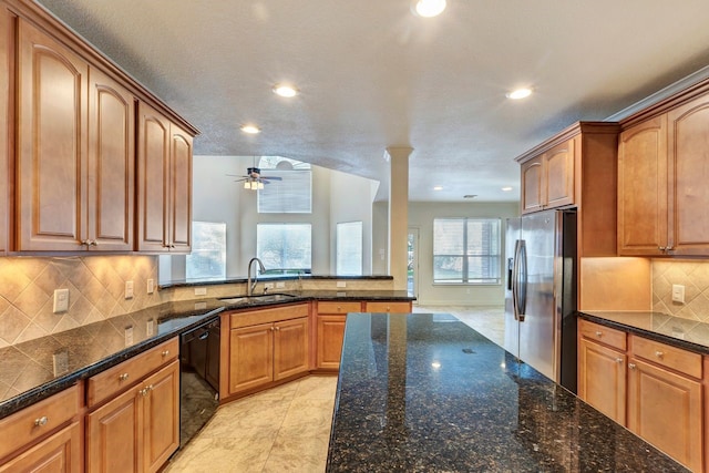 kitchen featuring dishwasher, sink, decorative backsplash, a textured ceiling, and stainless steel fridge with ice dispenser