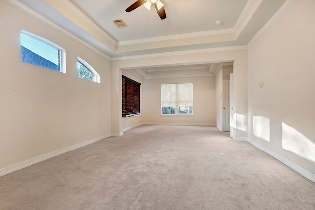19238 Clear Sky Dr, Humble, TX 77346 - unfurnished room featuring ceiling fan, light carpet, a tray ceiling, visible vents, and ornamental molding