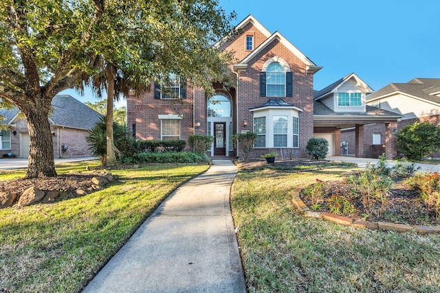 19238 Clear Sky Dr, Humble, TX 77346 - traditional home featuring a garage, a front lawn, and brick siding