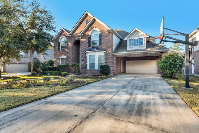 19238 Clear Sky Dr, Humble, TX 77346 - traditional home with brick siding, driveway, a front lawn, and a garage