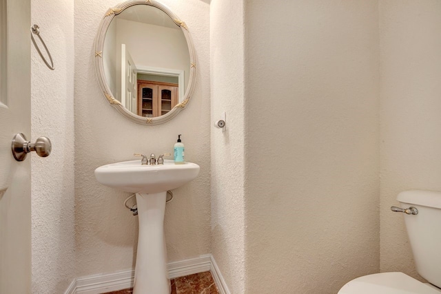 bathroom featuring toilet