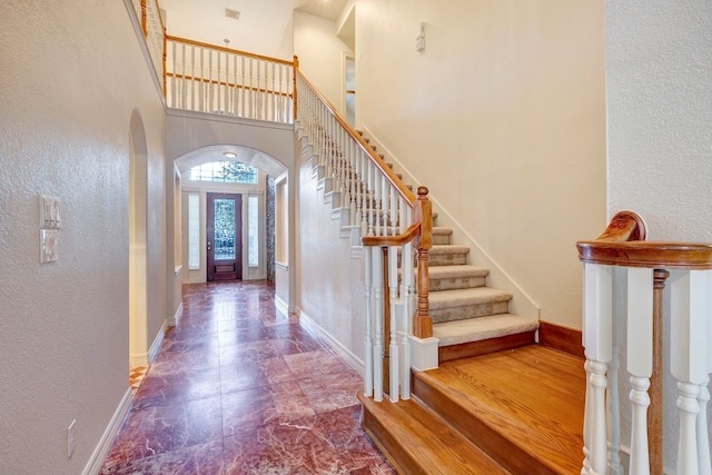 foyer entrance featuring a high ceiling