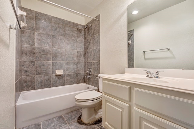 19238 Clear Sky Dr, Humble, TX 77346 - bathroom featuring shower / bathing tub combination, tile patterned flooring, vanity, toilet, and a textured wall