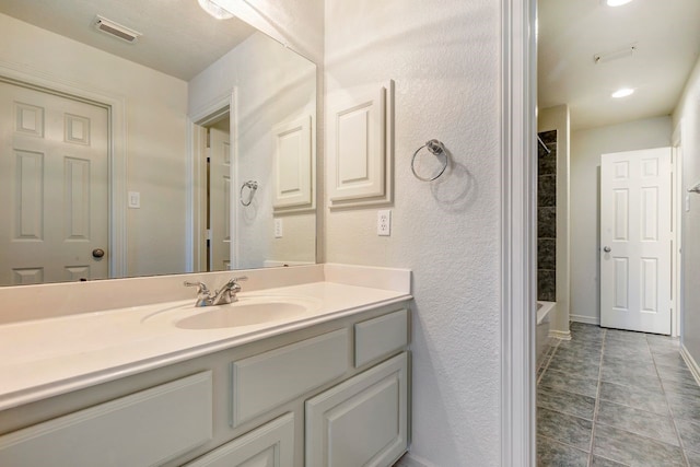 19238 Clear Sky Dr, Humble, TX 77346 - bathroom featuring  shower combination, tile patterned floors, visible vents, baseboards, and vanity