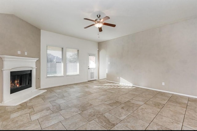 unfurnished living room with ceiling fan