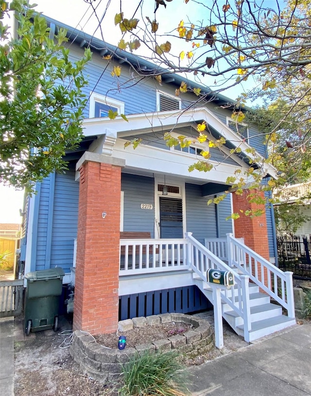 entrance to property with a porch