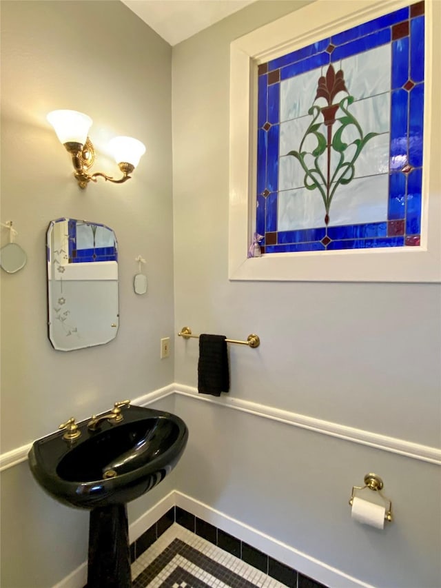 bathroom featuring tile patterned floors and sink