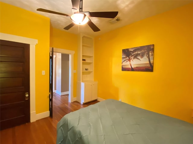 bedroom featuring hardwood / wood-style floors and ceiling fan