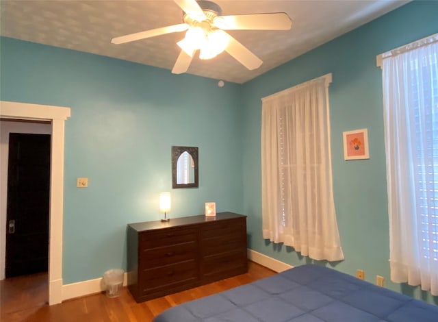 bedroom featuring hardwood / wood-style floors and ceiling fan