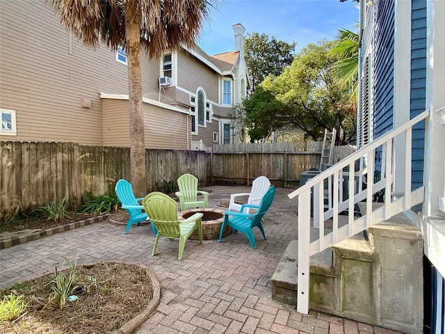 view of patio / terrace featuring an outdoor fire pit