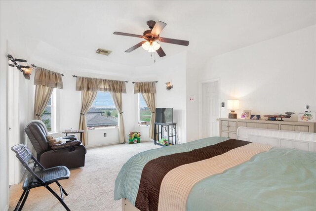 bedroom with light carpet and ceiling fan