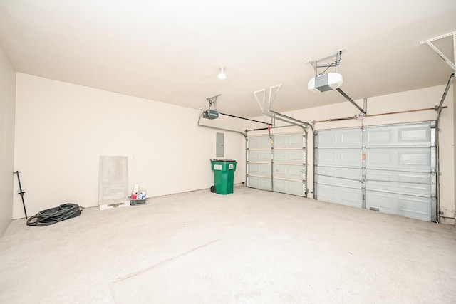 garage with electric panel and a garage door opener