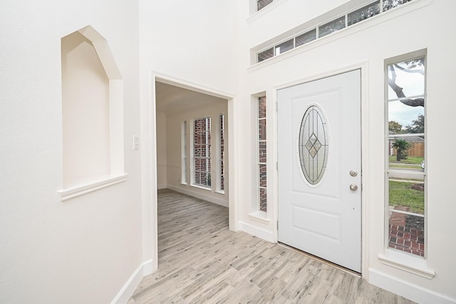 entryway with light hardwood / wood-style flooring