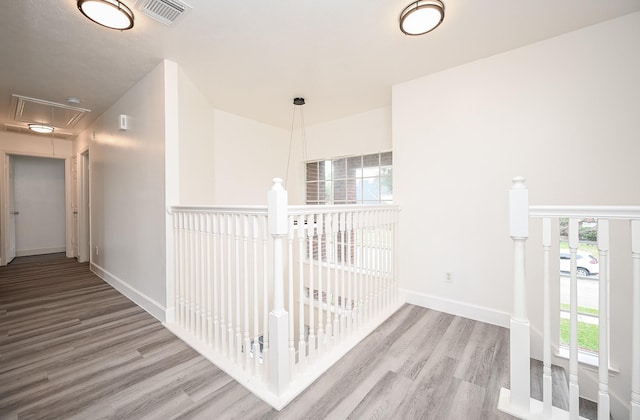 hall with hardwood / wood-style flooring