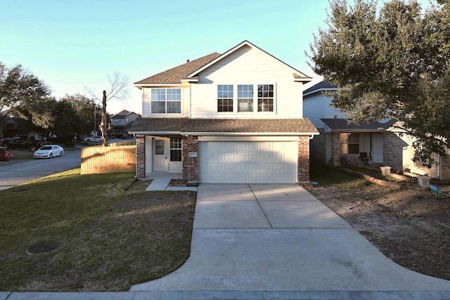 front facade featuring a front yard and a garage