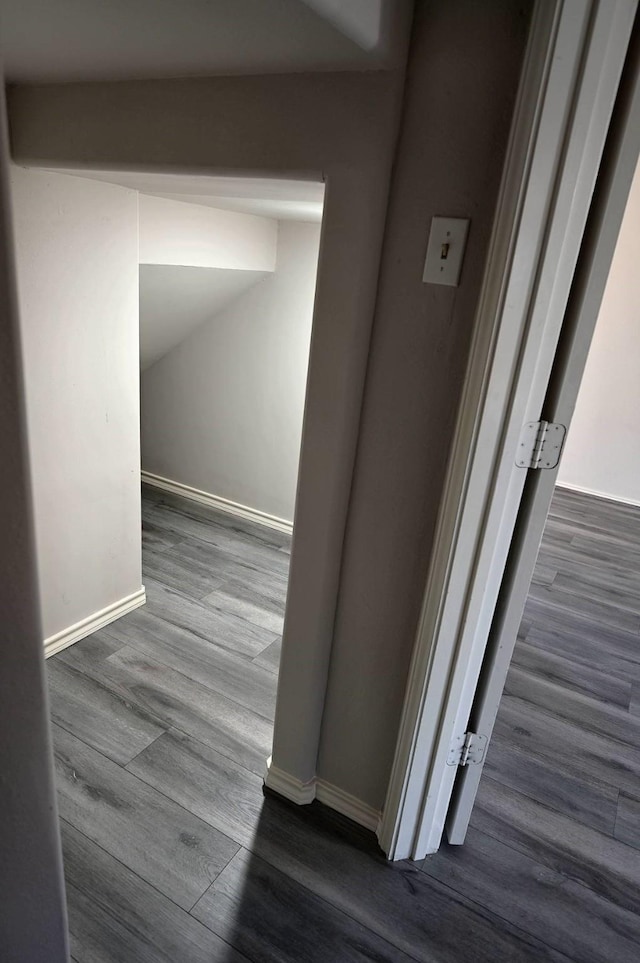 hallway with dark hardwood / wood-style floors