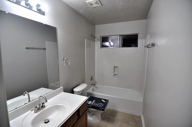 full bathroom featuring a textured ceiling, tile patterned flooring, vanity, toilet, and bathtub / shower combination