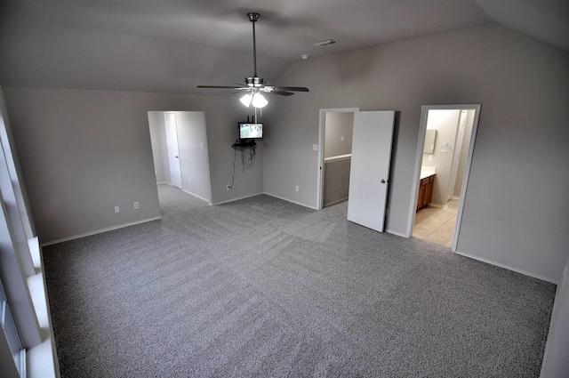 unfurnished living room with ceiling fan, light colored carpet, and vaulted ceiling