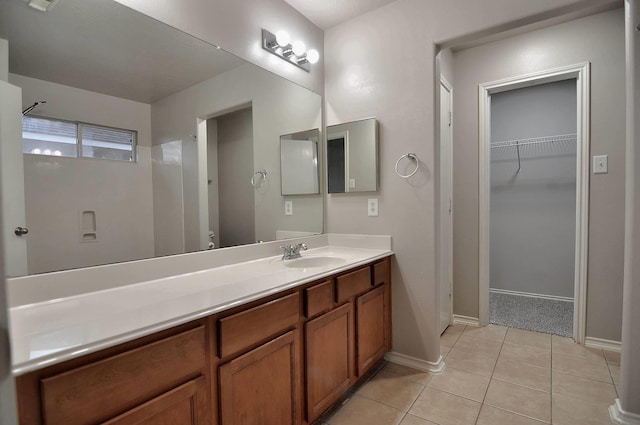 bathroom with tile patterned floors and vanity