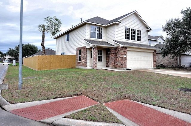 view of front property featuring a front yard and a garage