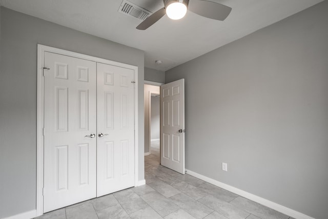 unfurnished bedroom featuring a closet and ceiling fan