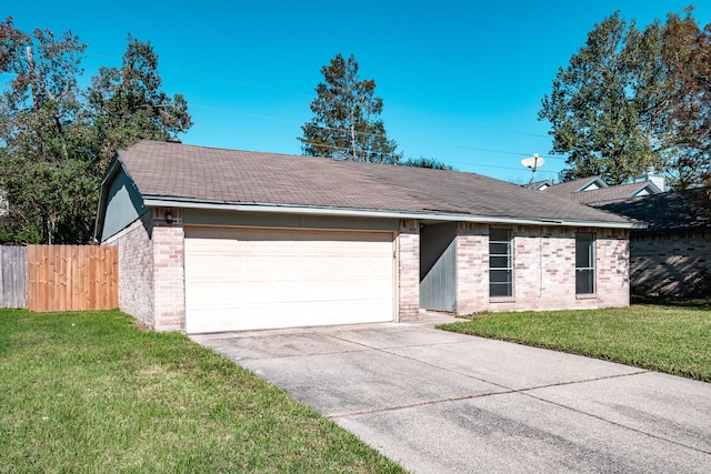 ranch-style house with a garage and a front lawn