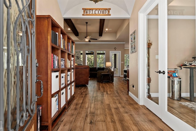 foyer featuring beam ceiling, french doors, hardwood / wood-style flooring, and ceiling fan