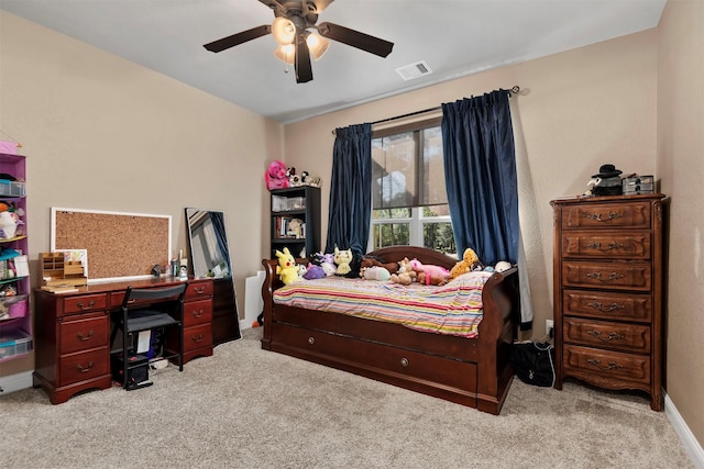 bedroom with baseboards, a ceiling fan, visible vents, and light carpet