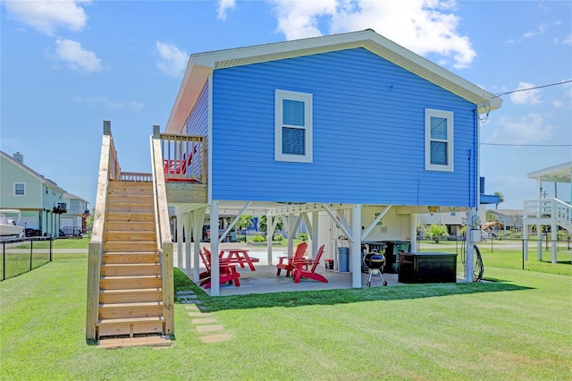 view of play area with a patio and a lawn