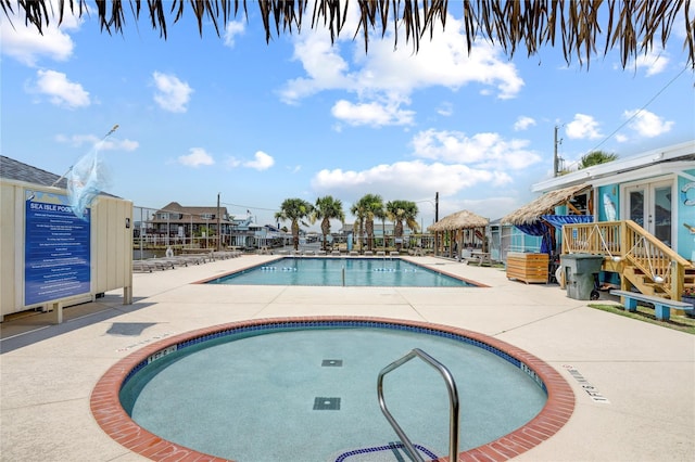 view of swimming pool featuring a patio