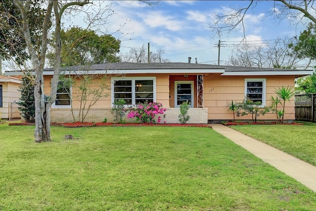 ranch-style house with a front lawn