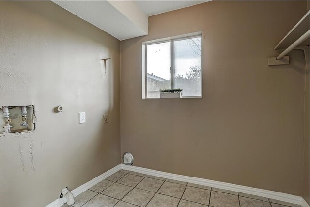 laundry room with light tile patterned floors