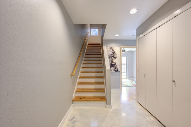 stairway with concrete floors