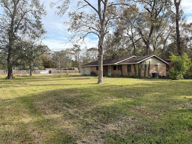 view of yard featuring central air condition unit