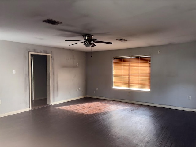 spare room with hardwood / wood-style floors and ceiling fan