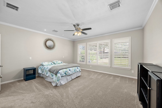 bedroom with ceiling fan, ornamental molding, and light carpet