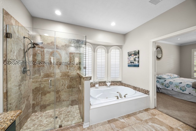 bathroom with shower with separate bathtub and tile patterned floors